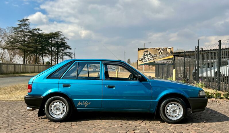 
								Mazda 323 130 Midge full									