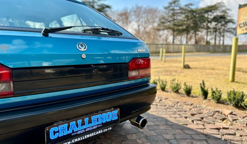 
								Mazda 323 130 Midge full									